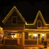 A building decorated with Christmas lights at night. Produktbild-Vorschau