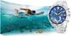 A swimmer in the ocean next to a watch. Podgląd zdjęcia produktu