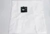 A white vacuum cleaner bag with a black plastic fitting. Produktbild-Vorschau