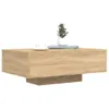A coffee table with a plant and a cup on it, against a white background. Produktbild-Vorschau