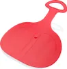 A red plastic sled is shown against a white background. Voir les images du produit