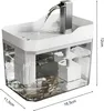A pet water fountain with water flowing from a spout into the basin. Produktbild-Vorschau