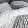 Close-up of bedding with text patterns. Produktbild-Vorschau