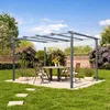 A pergola with a dining set in a backyard garden. Voir les images du produit