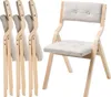 A set of four folding chairs, with one chair unfolded and displayed prominently on the right, and three chairs folded and stacked on the left. Podgląd zdjęcia produktu
