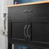 Close-up of a black kitchen cart with a wooden countertop and silver handles. Produktbild-Vorschau