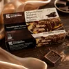 Kandylas Halva Schokolade 400 g mit Seidentuch und Schokolade auf Holz Produktbild-Vorschau