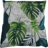 A close-up view of a pillow with a tropical leaf pattern. Produktbild-Vorschau