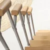 A close-up view of a space-saving staircase with a single railing, showing the wooden steps and metal supports. Produktbild-Vorschau