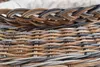 A close-up view of the woven texture of a laundry basket. Produktbild-Vorschau