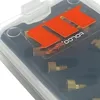 Close-up view of a product kit inside its clear plastic packaging. Náhled obrázku produktu