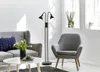 A modern living room with a sofa, armchair, coffee table, and a floor lamp. Náhled obrázku produktu