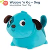 A blue plush dog toy with brown ears and eye patches, sitting on a white background. Náhled obrázku produktu