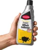 A hand holds a bottle of Caramba Oelfleck Entferner. Produktbild-Vorschau