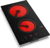 A black vitroceramic cooktop with two red heating elements is shown from a slightly elevated angle against a white background. Produktbild-Vorschau