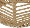 A close-up view of a woven lamp shade made of natural fibers. Náhled obrázku produktu
