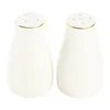 A pair of white salt and pepper shakers with gold trim, displayed against a white background. Náhľad obrázku produktu
