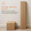 Two cardboard boxes are shown against a plain wall. One is a tall, narrow box, and the other is a smaller, cube-shaped box. Text on the left side of the image indicates that the product will be shipped in multiple packages. Produktbild-Vorschau