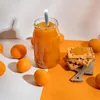 A jar of apricot jam with apricots and waffles. Produktbild-Vorschau