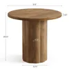A round wooden table with a fluted pedestal base, shown with dimensions indicated. Produktbild-Vorschau