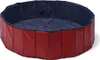 A round, collapsible dog pool with red outer walls and a blue inner lining. Anteprima dell’immagine prodotto