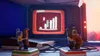 Two figures playing a retro video game on a vintage television. Náhled obrázku produktu