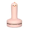 A pink chick-shaped mini desk vacuum cleaner is shown against a white background. Produktbild-Vorschau