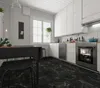 A modern kitchen with black marble flooring, white cabinets, and a dining table. Produktbild-Vorschau