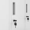 Close-up view of two white metal locker doors with integrated handles and keys in the locks. Anteprima dell’immagine prodotto