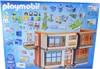 The image shows the packaging of a Playmobil children's hospital playset, displaying the building and various accessories and figures included. Produktbild-Vorschau