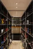 A long, narrow wine cellar with shelves filled with wine bottles on both sides. Náhľad obrázku produktu