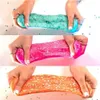 Three hands stretching colorful slimes with glitter. Náhled obrázku produktu