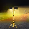 A woman running on a track at night, illuminated by a portable LED work light. Náhľad obrázku produktu