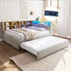 A bedroom scene featuring a sofa bed with integrated storage and LED lighting, with a pull-out trundle bed extended. Produktbild-Vorschau