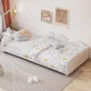 A child's bed with bedding and pillows in a room. Náhled obrázku produktu