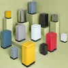 A collection of various colored pedal bins arranged on display blocks. Voir les images du produit