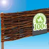 A close-up of a woven willow fence section against a bright blue sky with a sun glare. Produktbild-Vorschau
