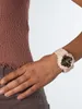 A close-up shot of a person's wrist wearing a pink Casio G-Shock watch. Produktbild-Vorschau
