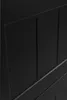 A close-up, angled view of a black cabinet door with vertical paneling. Náhled obrázku produktu