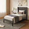 A bedroom scene with a bed, nightstand, and decor. Anteprima dell’immagine prodotto