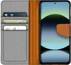 A flip case for a smartphone, open to show the phone and card slots. Anteprima dell’immagine prodotto
