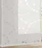 A close-up view of a white panel curtain with a gray dotted line and circle pattern. Produktbild-Vorschau