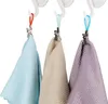 Three fabric towels hanging from hooks. Anteprima dell’immagine prodotto