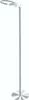 A minimalist floor lamp with a circular base and a curved top. Produktbild-Vorschau