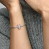 A close-up shot of a person's arm wearing a Pandora Lilo & Stitch charm bracelet. Náhled obrázku produktu