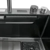 A close-up view of a modern stainless steel kitchen sink with integrated controls. Náhled obrázku produktu