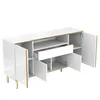 A white sideboard with gold accents and legs, shown with its doors and drawer open. Produktbild-Vorschau