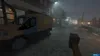 A voxel-style video game scene depicting a street at night with rain. A truck is parked on the left, and the player is holding a hammer in the foreground. Produktbild-Vorschau