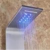 A close-up view of a modern LED shower panel with water flowing and blue lights illuminated. Náhľad obrázku produktu