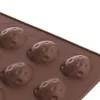 A close-up view of a brown silicone mold with multiple indentations shaped like nuts. Anteprima dell’immagine prodotto